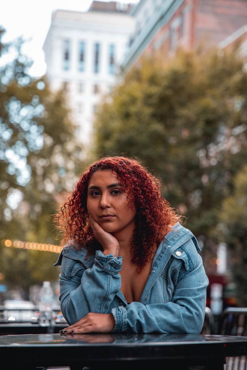Woman with full, curly red hair